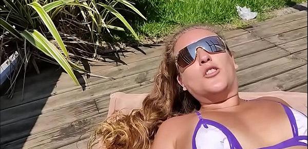  My slut sunbathing on the beach with duct tape bikini